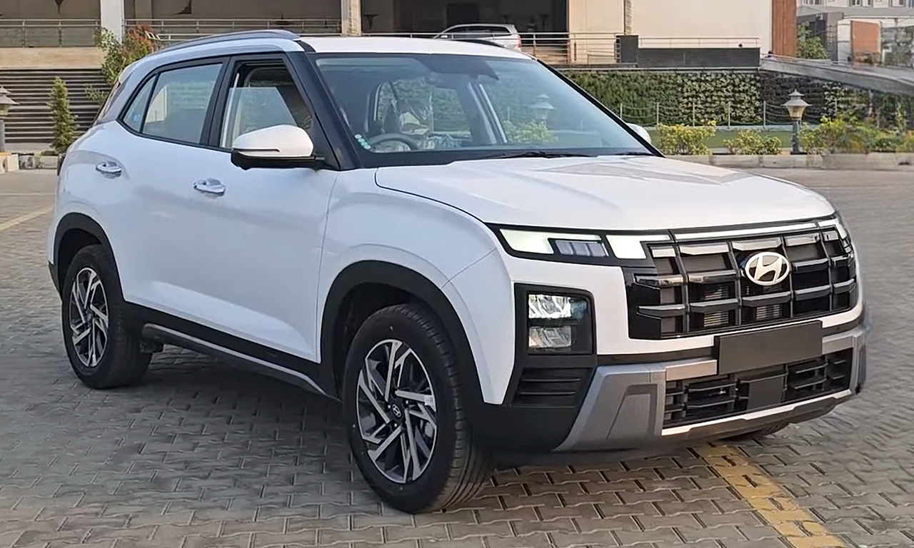 Real photograph of a white 2024 Hyundai Creta SUV, a popular car model in India, in a front three-quarter view